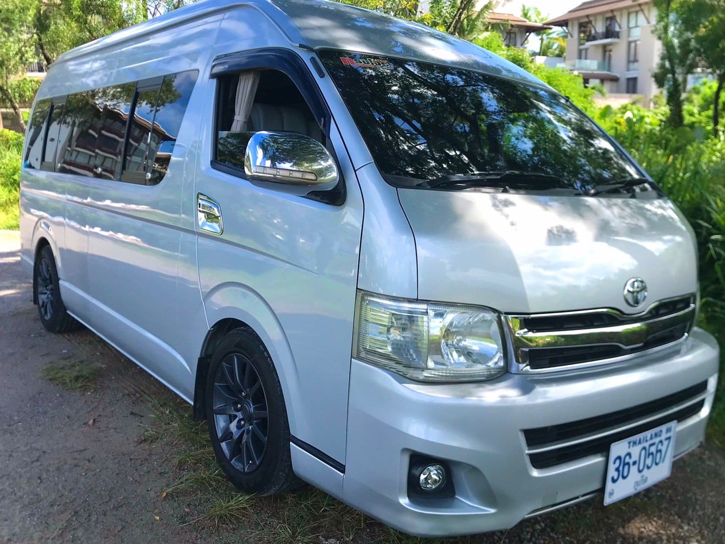 Clean silver Toyota HiAce van parked at a Khao Lak hotel